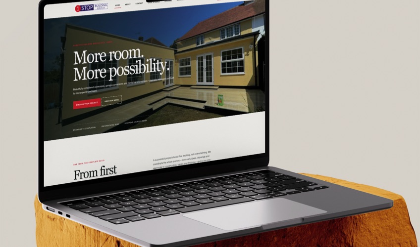 The 1 Stop Building website displayed on a laptop